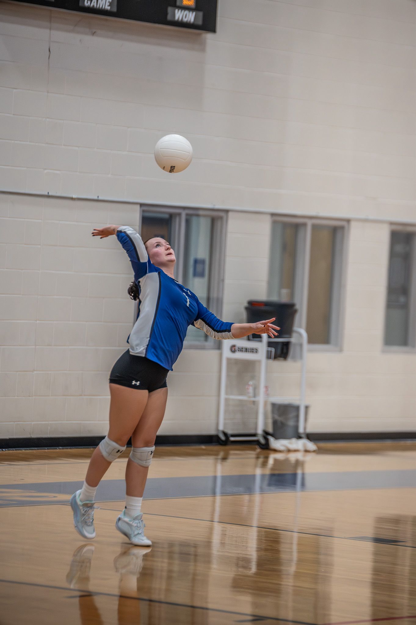Volleyball player following through after a serve